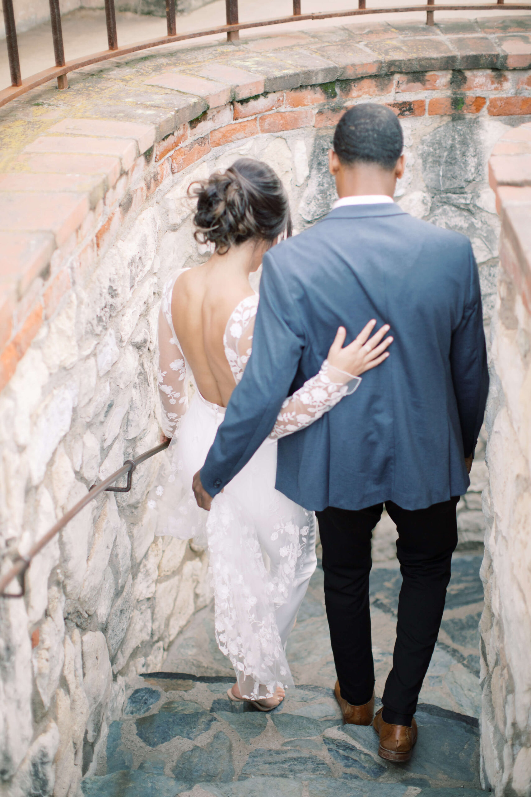 Couple walking hand-in-hand during mindful outdoor wedding ceremony.